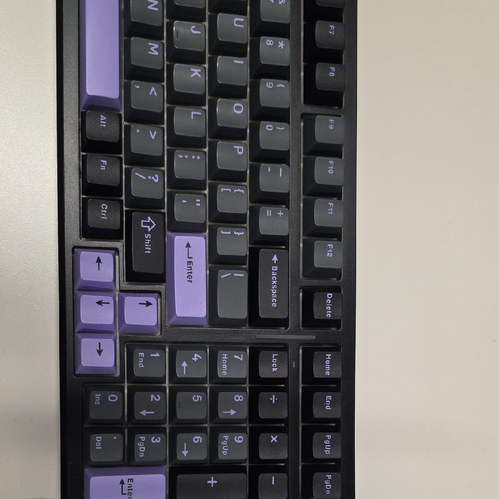 Mechanical Keyboard with Purple and Black Keys